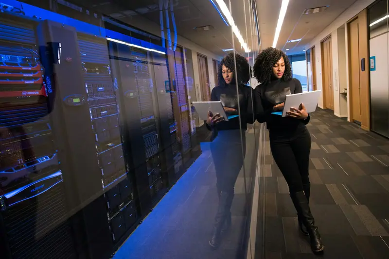 Engineer reviewing code on a monitor