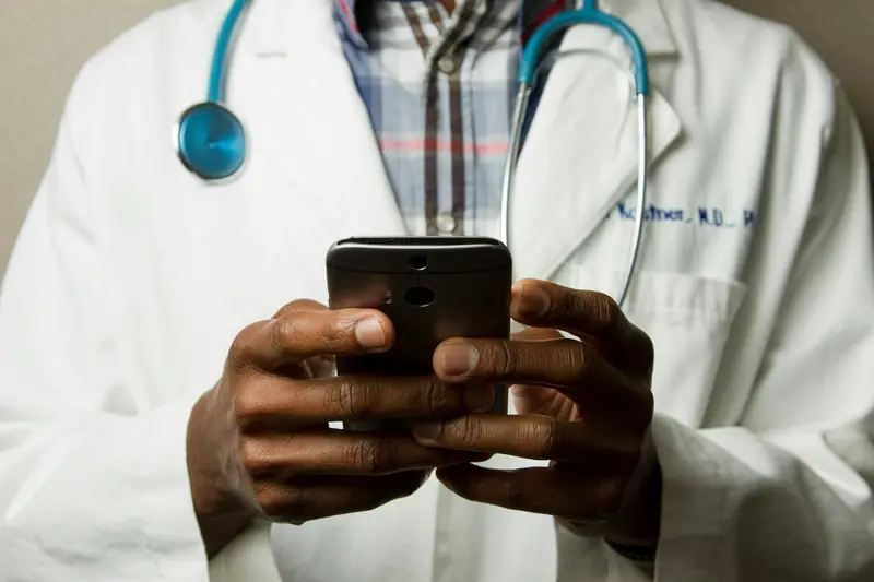 Clinician reviewing records on a tablet